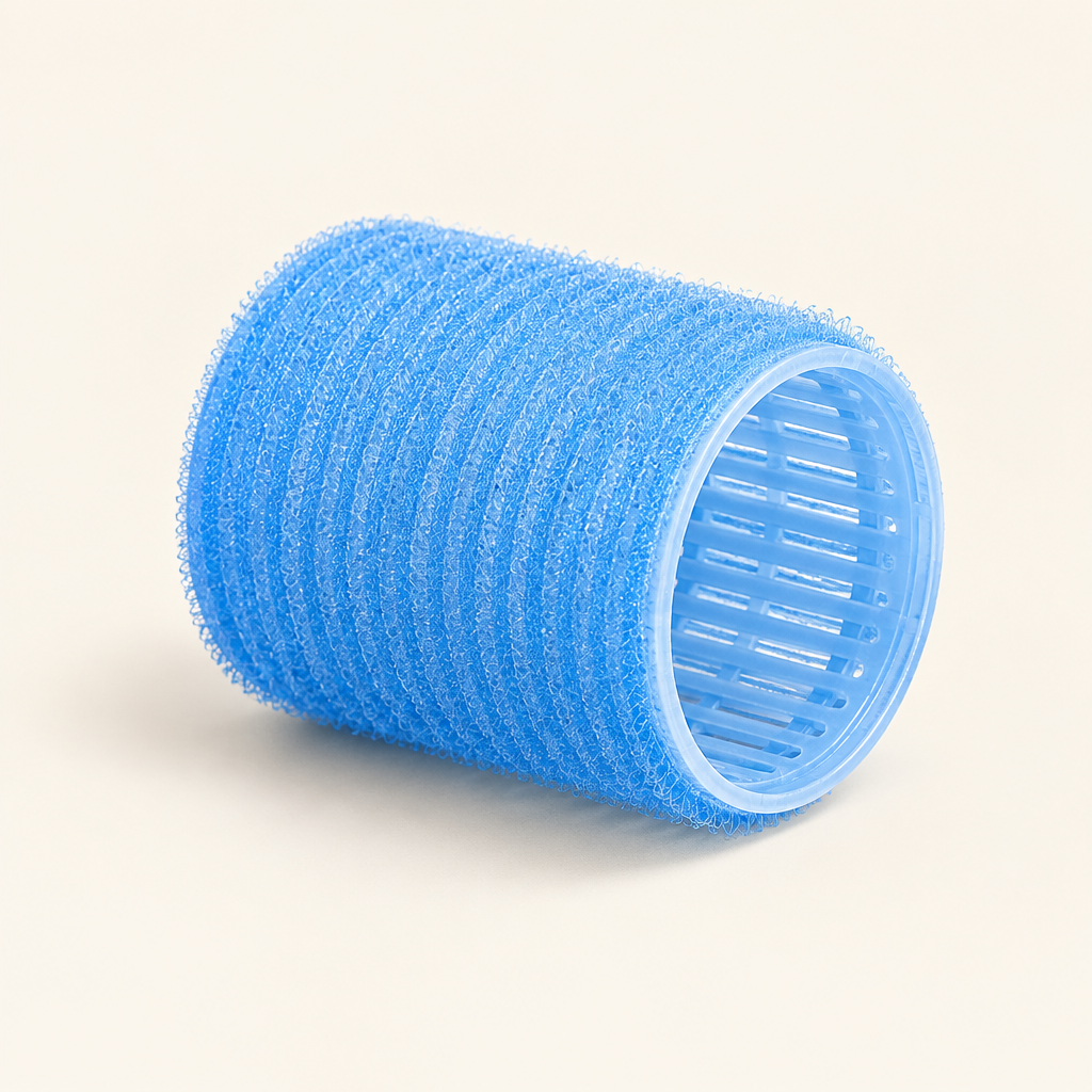 Blue hair roller on an ivory background