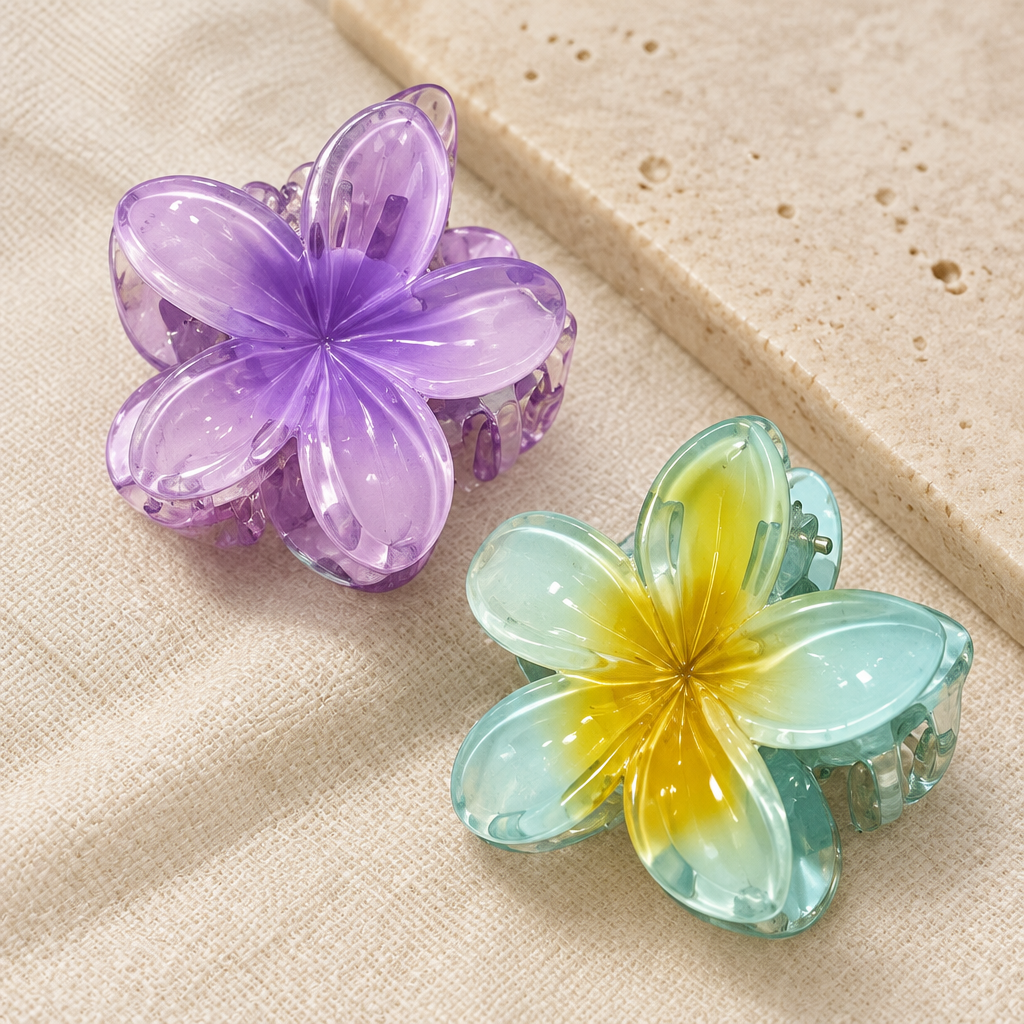 Close-up of lavender and aqua translucent flower hair claw clips
