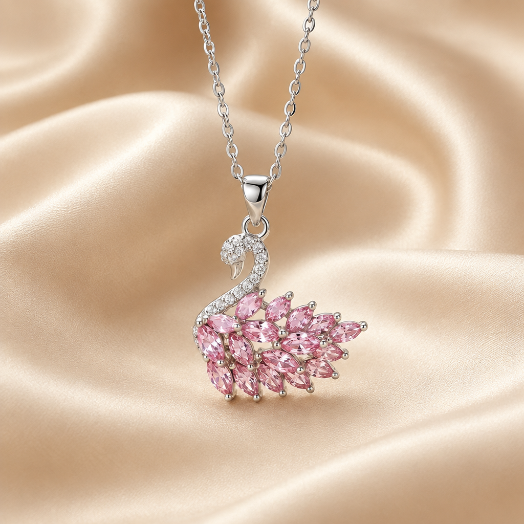 Silver-tone pink swan pendant necklace on ivory silk