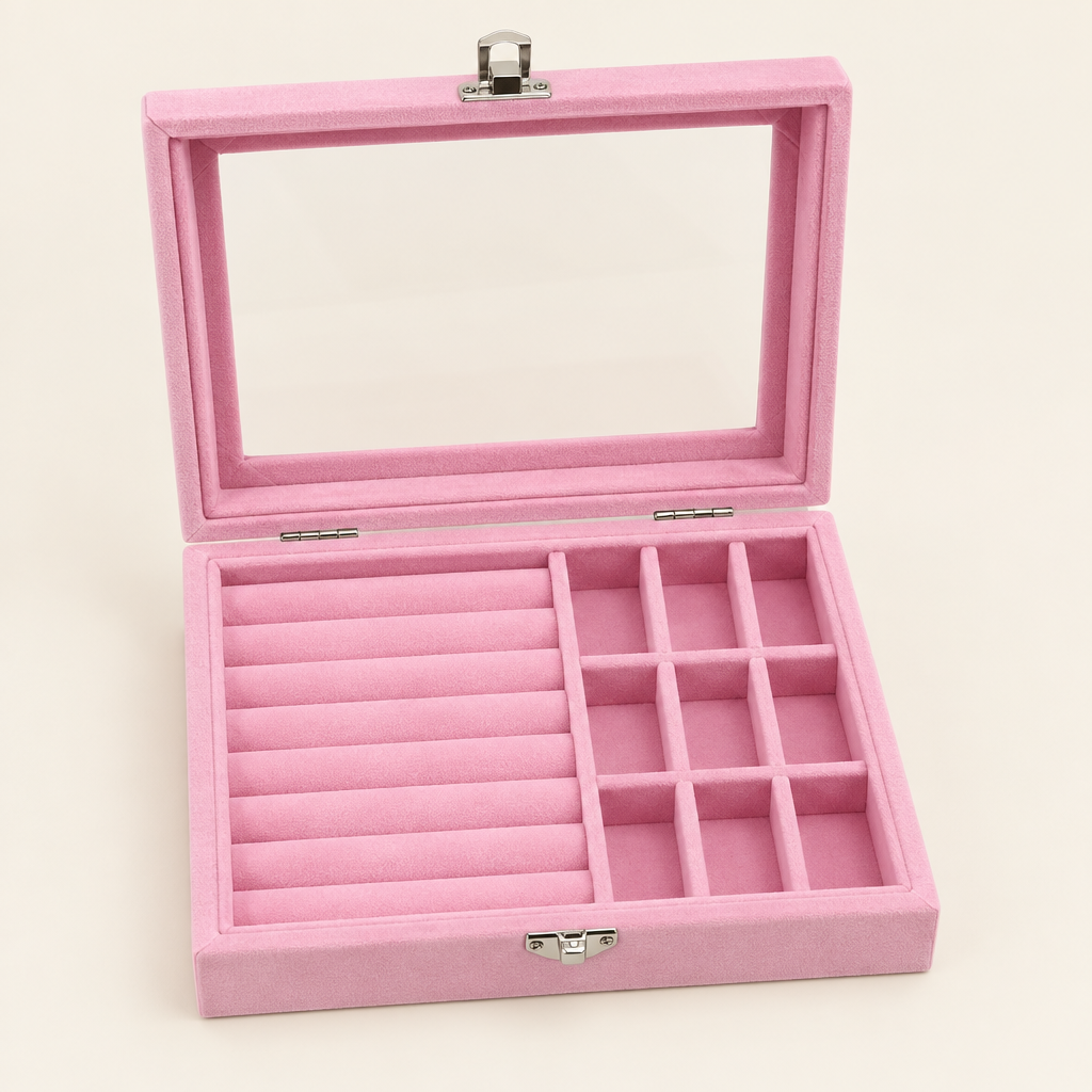 Close view of pink jewelry box ring rows, compartments and clear lid