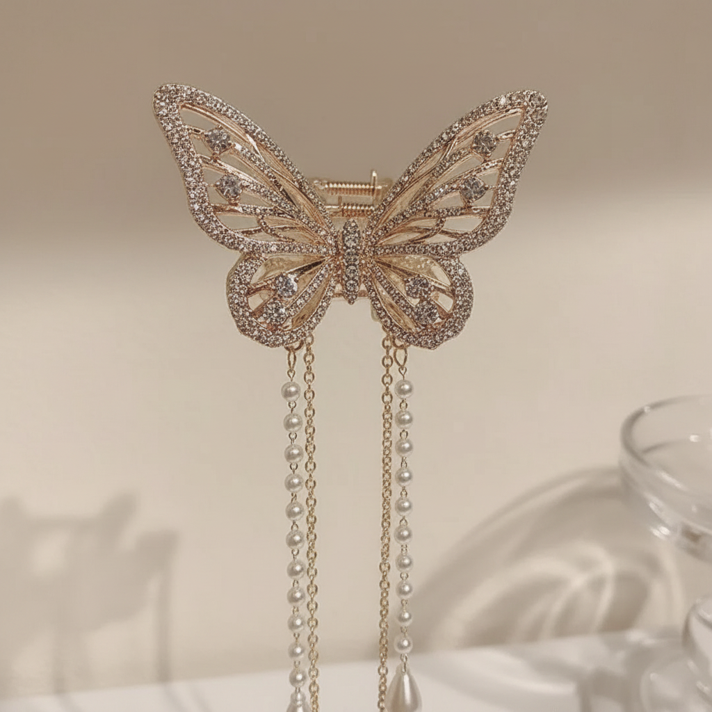 Close-up of zircon-set butterfly wings and pearl tassel drops