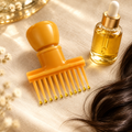 Root comb hair oil applicator styled with hair oil dropper bottle and hair