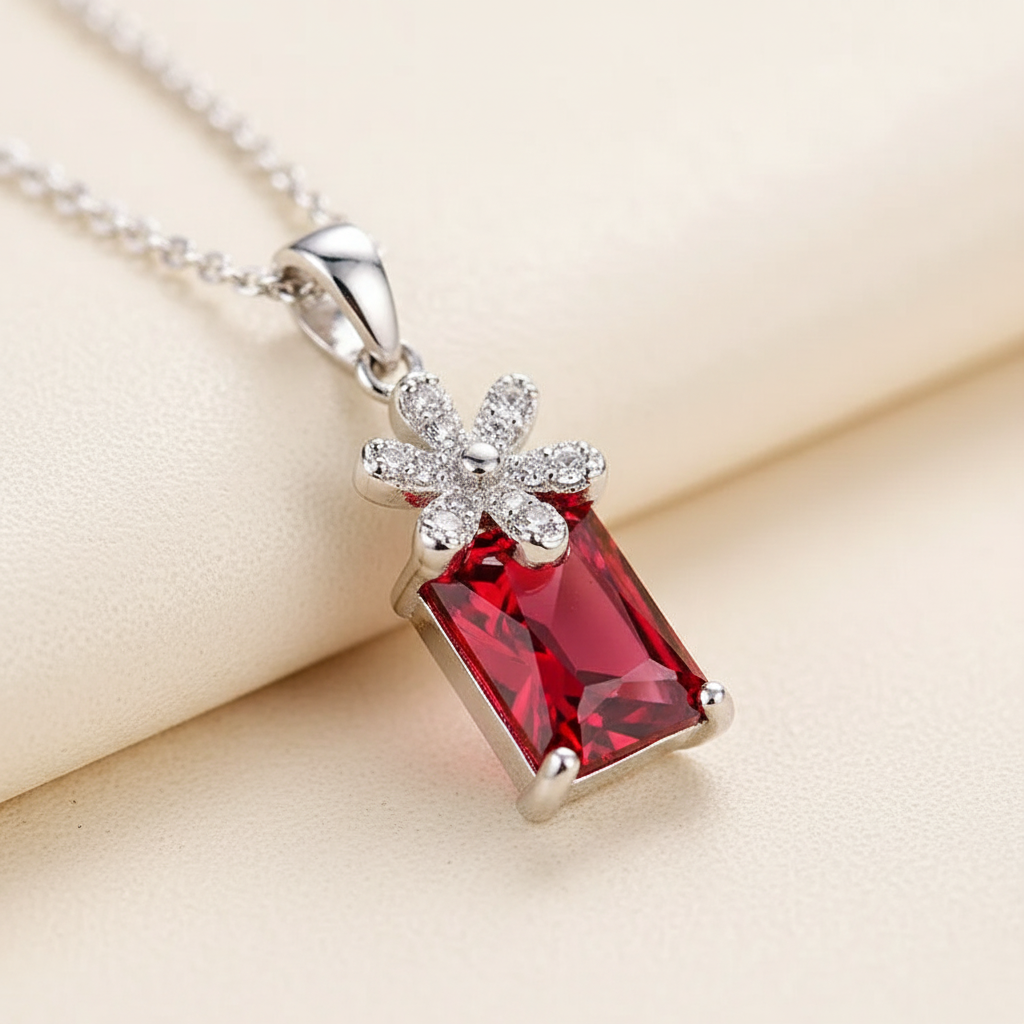 Close-up of the emerald-cut zircon pendant with pave crystal floral accent