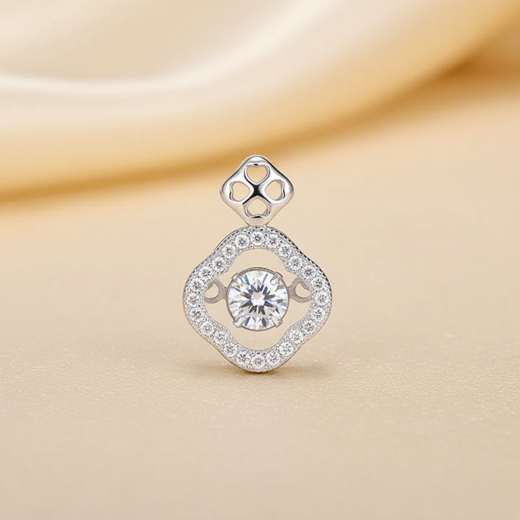 Close detail of the platinum-tone clover pavé pendant and centre stone