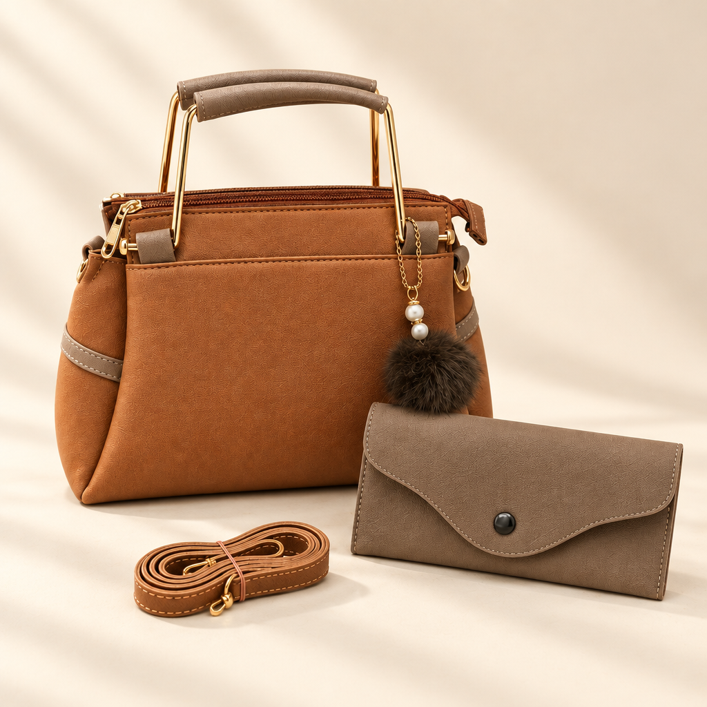 Close view of tan structured handbag, taupe envelope wallet and detachable strap