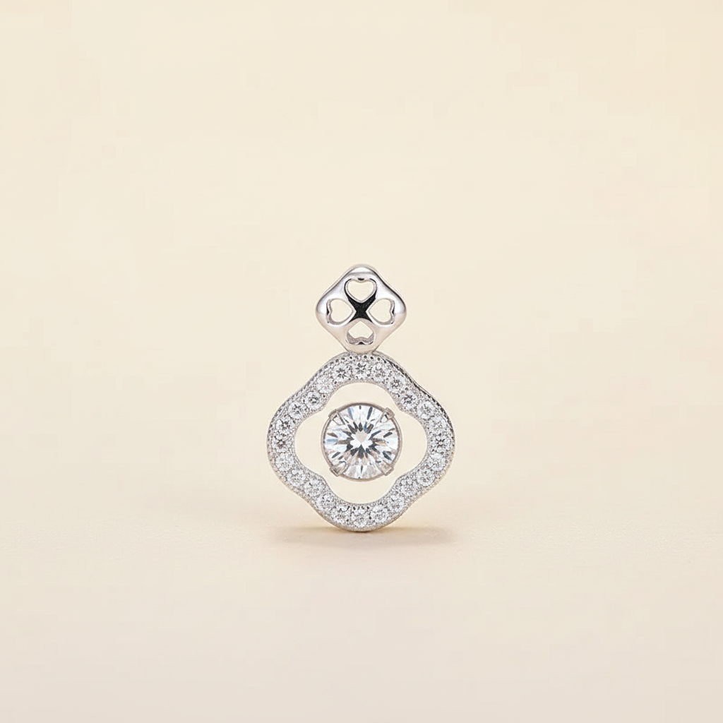 Platinum-tone 925 sterling silver clover pavé pendant shown alone on a warm ivory background