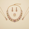 Multicolour pearl stone necklace set arranged on a warm ivory studio background
