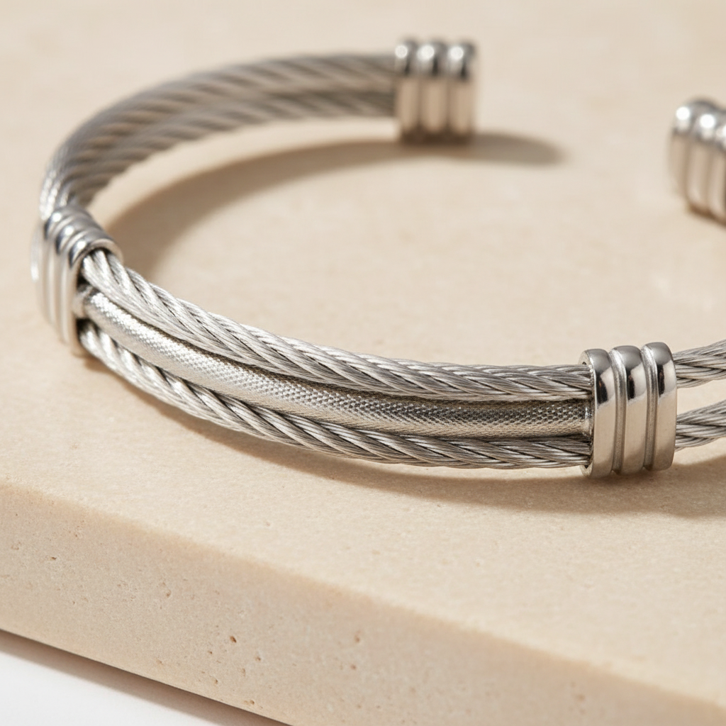 Close-up of silver braided cable texture and polished cuff detailing