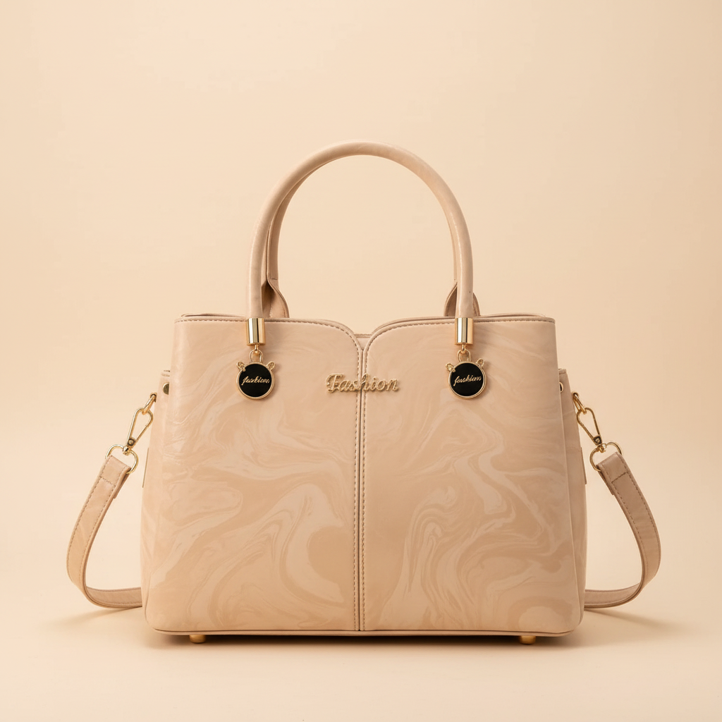 Beige structured faux leather top-handle tote bag with gold-tone hardware and detachable shoulder strap on an ivory background