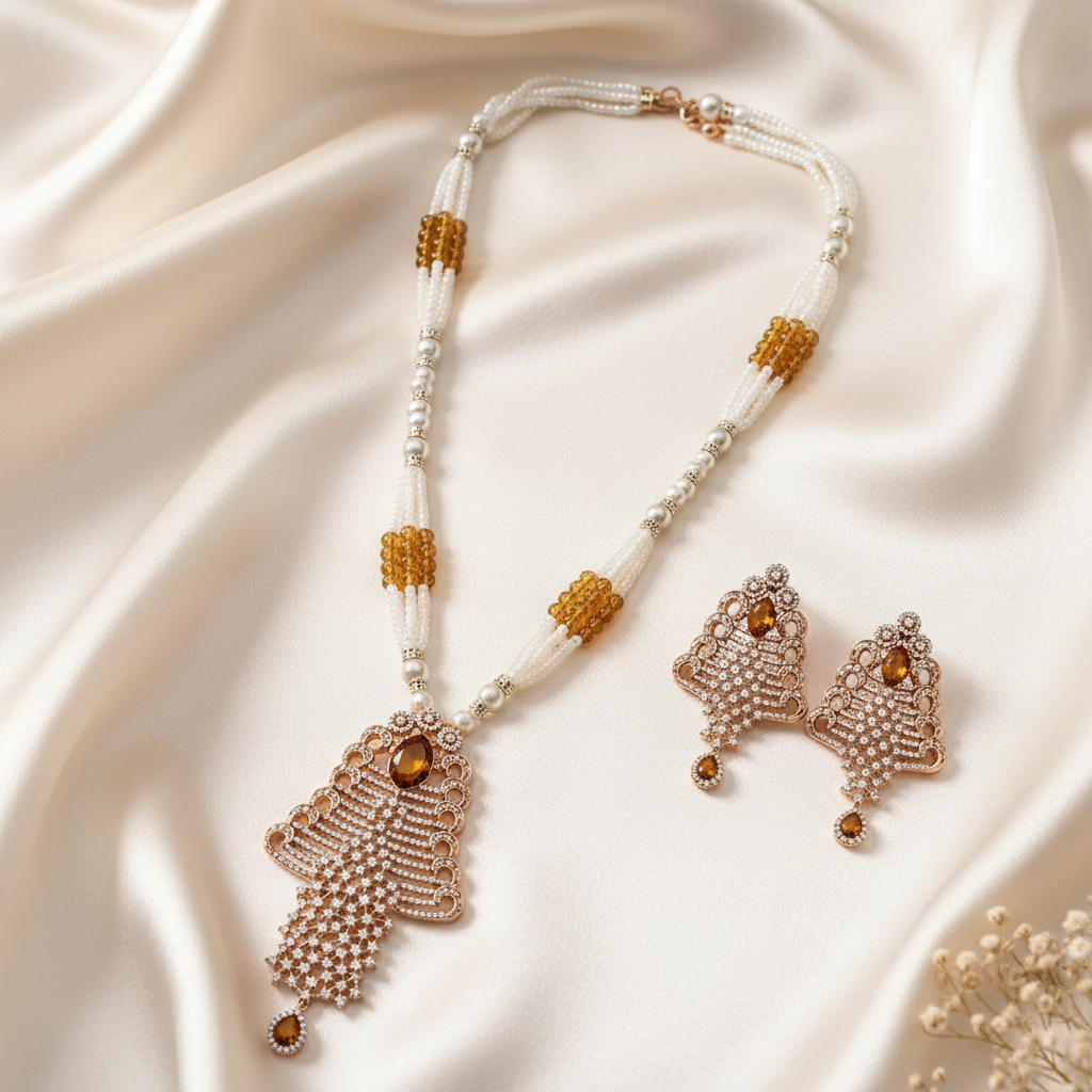 Pearl-style crystal pendant necklace with matching drop earrings on warm ivory silk