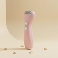 Pink rechargeable electric foot file with grey exfoliating roller on an ivory background