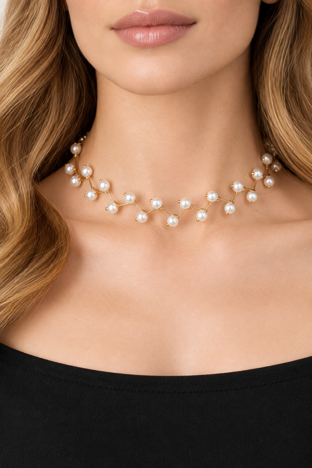 Model wearing a white pearl vine necklace with gold-tone branches